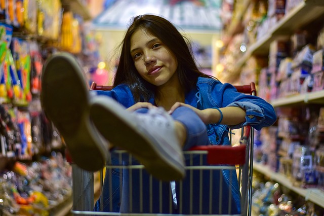 woman in supermarket shopping cart